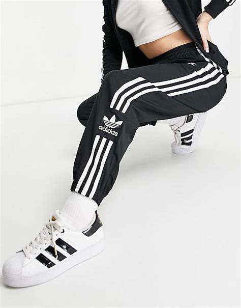 adidas Originals Lock Up three stripe track pants in .